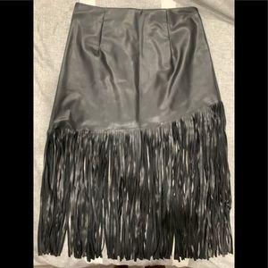 Black leather skirt with fringe.
